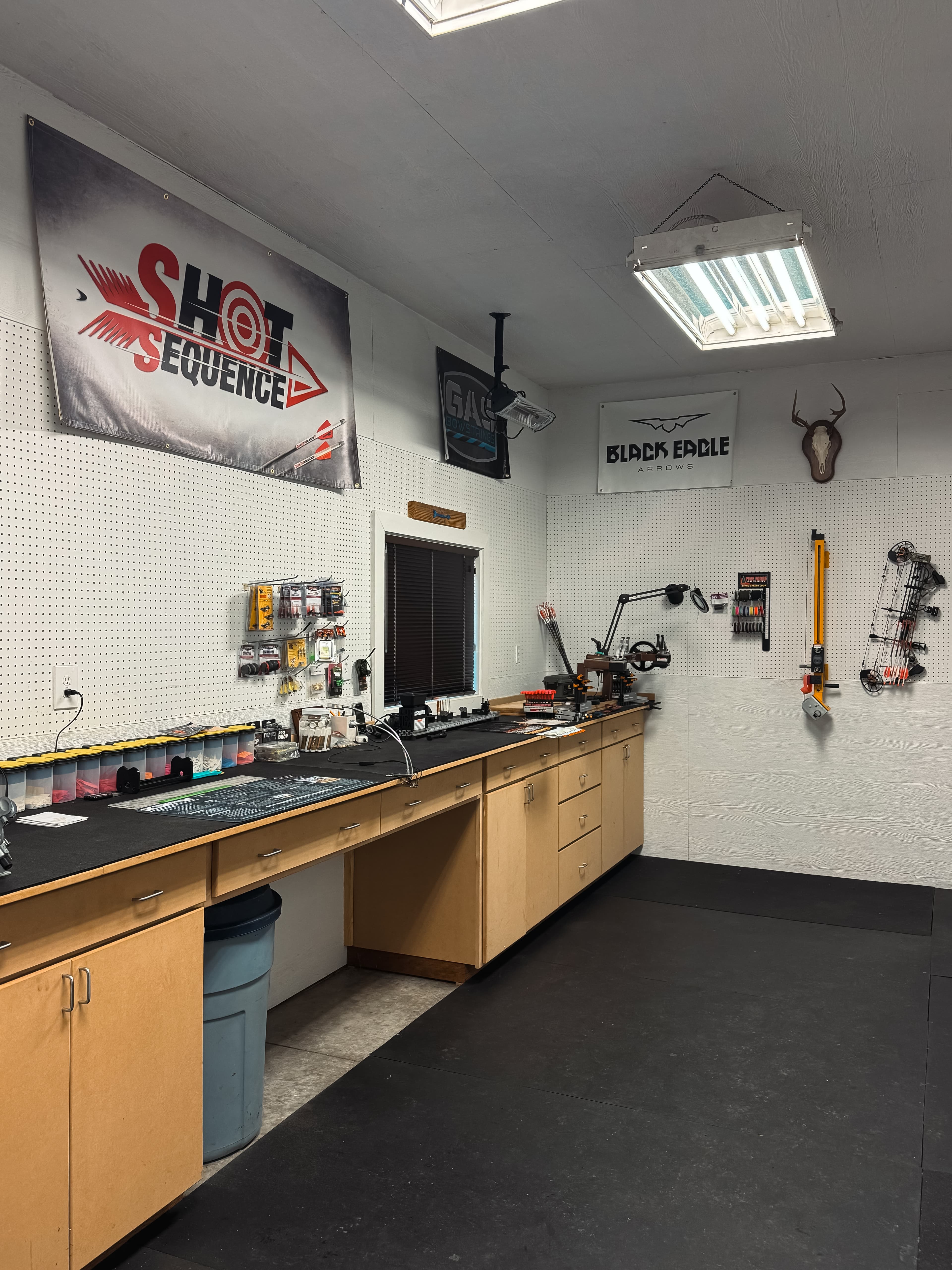 Shot Sequence Archery shop interior with professional equipment and technicians